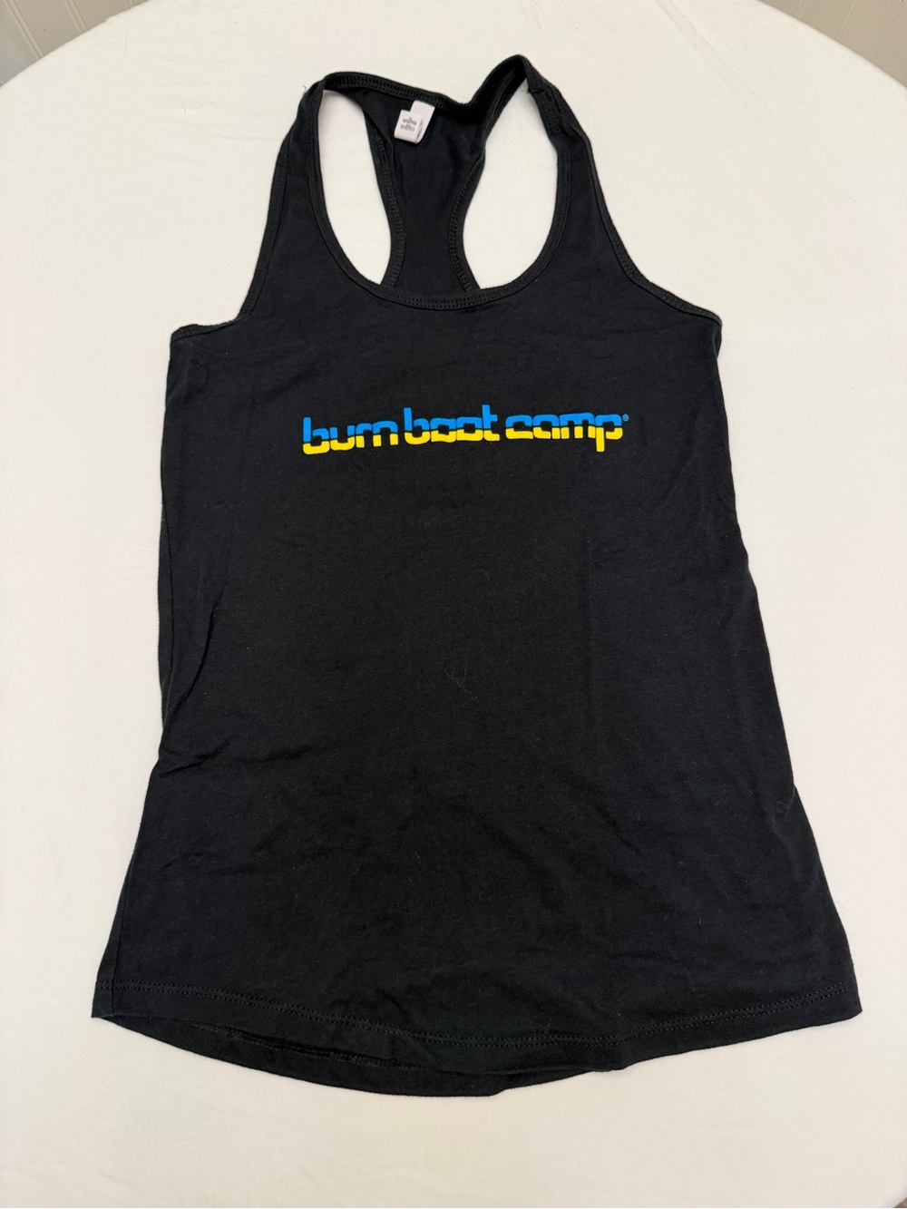 Burn Boot Camp Women's Black Racerback Tank with Blue and Yellow Logo